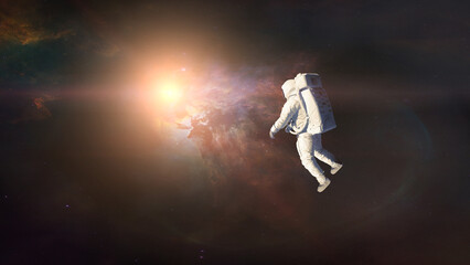 Wall Mural - cosmonaut floating in deep space on nebula background. elements of this image furnished by nasa.