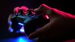 closeup hand with console game in rgb light background