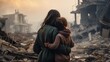An adult brunette in a green coat is hugging a young girl in a brown sweater, both standing with their backs to the camera in front of destroyed buildings. The concept of wars and destruction.
