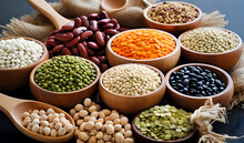 A Variety Of Dried Legumes Are Arranged In A Bowl On A Marble Table. The Beans Are A Variety Of Colors And Shapes, And They Are Arranged In A Neat And Tidy Way.
