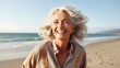 © Fred - image of happy mature woman at the beach