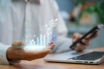 Global business growth analysis and asset investment chart. businessman holding symbol of digital marketing and target of leadership, unlock your goals with strategy and planning.