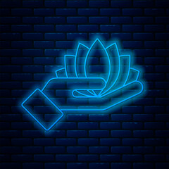 Wall Mural - Glowing neon line Lotus flower icon isolated on brick wall background. Vector