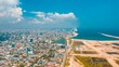 Aerial view of Lagos cityscape before the sea on a sunny day