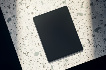 Aufkleber - Top view of empty black tablet on spotted table. Mock up, 3D Rendering.