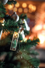 Wall Mural - closeup - elegant christmas tree in glass jar with bokeh lights on christmas tree, christmas and new