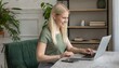 © Nicolas - blond girl is working from home concept with a nice view