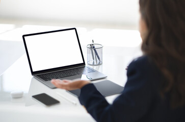Poster - Over shoulder shot of corporate businesswoman using computer