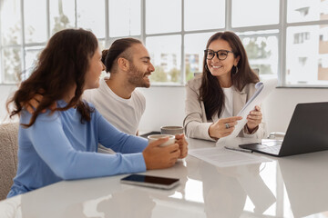 Wall Mural - Happy Homebuyers. Spouses Having Consultation In Real Estate Agency