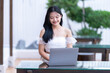 © Thinapob - Portrait of asian freelance teenage people businesswoman casual working with laptop computer in cafe interior in coffee shop background,business expressed confidence embolden and successful concept