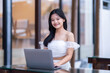 © Thinapob - Portrait of asian freelance teenage people businesswoman casual working with laptop computer in cafe interior in coffee shop background,business expressed confidence embolden and successful concept