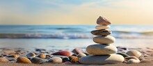 Balanced Rock Pyramid On Pebbled Beach With Golden Sea Bokeh Zen Stones On Sea Beach Conveying Meditation Spa Harmony And Balance Copy Space Image Place For Adding Text Or Design