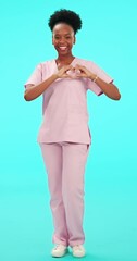 Poster - Smile, hands and heart with a nurse black woman on blue background in studio for healthcare. Portrait, medical and emoji with a happy young female medicine professional in scrubs for love or wellness