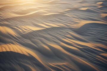  Aerial view of wavy sand dunes casting intricate shadows at dusk