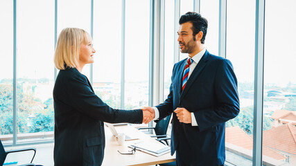 Poster - business people handshake in corporate office showing professional agreement on a financial deal con