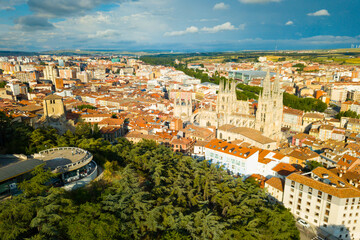 Wall Mural - View from drone of impressive Burgos Gothic Cathedral on background of cityscape in summer day, Spain