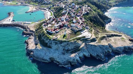 Wall Mural - view of the town karaburun with its lighthouse on a cliff