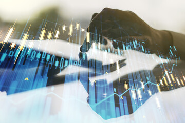 Double exposure of abstract creative financial diagram with finger clicks on a digital tablet on background, banking and accounting concept