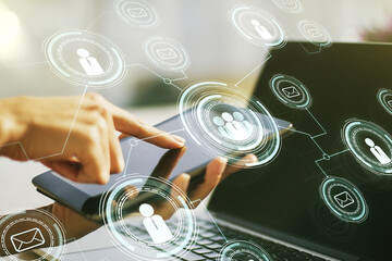 Poster - Double exposure of social network icons concept and hand working with a digital tablet on background. Networking concept