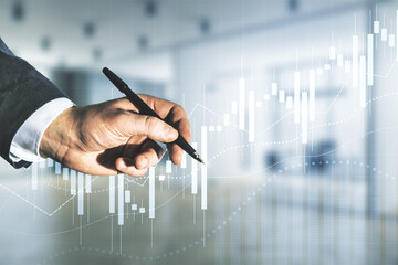 Poster - Double exposure of man hand with pen working with virtual creative financial diagram on blurred office background, banking and accounting concept
