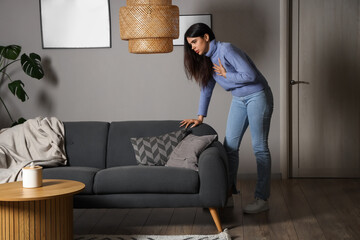 Wall Mural - Young woman having panic attack at home