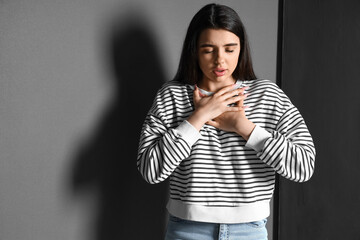 Wall Mural - Young woman having panic attack indoors