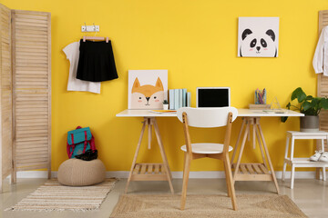 Wall Mural - Interior of modern room with workplace and stylish school uniform