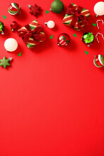 Christmas Frame Top Border With Festive Balls Decorations On Red Background. Vertical Christmas Banner, Poster Design.