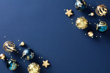 Wall Mural - Christmas elegant navy blue background adorned with festive baubles, golden stars, and stylish ornaments. Chic and classic design, featuring a touch of vintage charm, is perfect for creating a luxurio