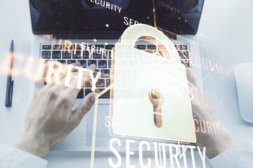 Poster - Creative idea concept with lock symbol and microcircuit illustration and hands typing on laptop on background. Protection and firewall concept. Multiexposure