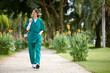 © DragonImages - Young medical intern in uniform walking to hospital in the morning