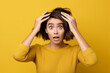 Closeup photo of young funny grimace girl touching head forgot turn off computer home isolated on yelow color background