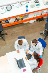 Wall Mural - team of biologist working with samples using laptop