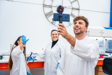 Wall Mural - team of scientists recording a video inside a lab
