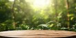 © Goojournoon - Wooden tabletop in the forest, background nature, There is space to place products.