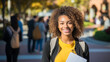 © BlazingDesigns - Portrait of a pretty cheerful young female african american student with folder and backpack outdoors. Education, goal or university with a female pupil outside after scholarship success.