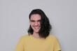 © Nadya - Portrait of laughing young man, teenager with long black hair