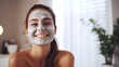 Attractive cheerful Smiling young woman applying face mask skin healthy and treatment therapy