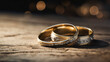 Wedding rings on a wooden table. Background for wedding ring