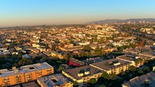 Aerial Shot Of Residential Buildings On City Landscape Against Clear Sky, Drone Flying Forward During Sunny Day - Culver City, California