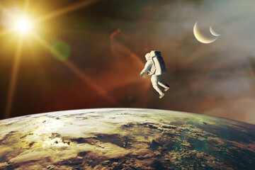 Wall Mural - spaceman on low-orbit of earth planet with sunlight. elements of this image furnished by nasa.