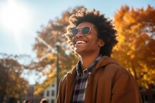 Happy High School Student With A Radiant Smile In A Vibrant Autumnal Landscape. Futuristic Elements, Afrocentric Aesthetics, Bold Patterns, And Metallic Accents