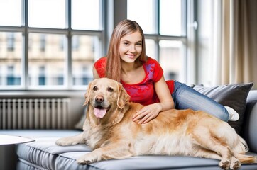 Poster - Happy cheerful young woman hugging pet dog