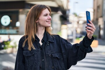 Sticker - Young blonde woman smiling confident making selfie by the smartphone at street