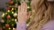 © Krakenimages.com - Young blonde woman celebrating christmas praying at home
