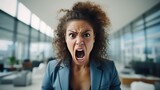 Fototapeta  - Angered, furious, crazy and mad millennial businesswoman or female office worker