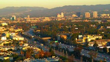 Aerial Panning Beautiful View Of Residential City By Mountains, Drone Flying On Sunny Day - Culver City, California