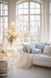 An airy, bright living room features delicate blossoming branches and plush cushions, exuding calm sophistication