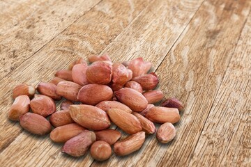 Poster - mixed tasty nuts in bowl on the desk