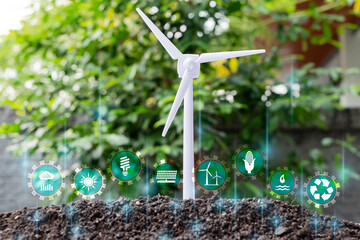 Wall Mural - green energy, eco energy concept. light bulb is located on the soil, and plant are growing with wind